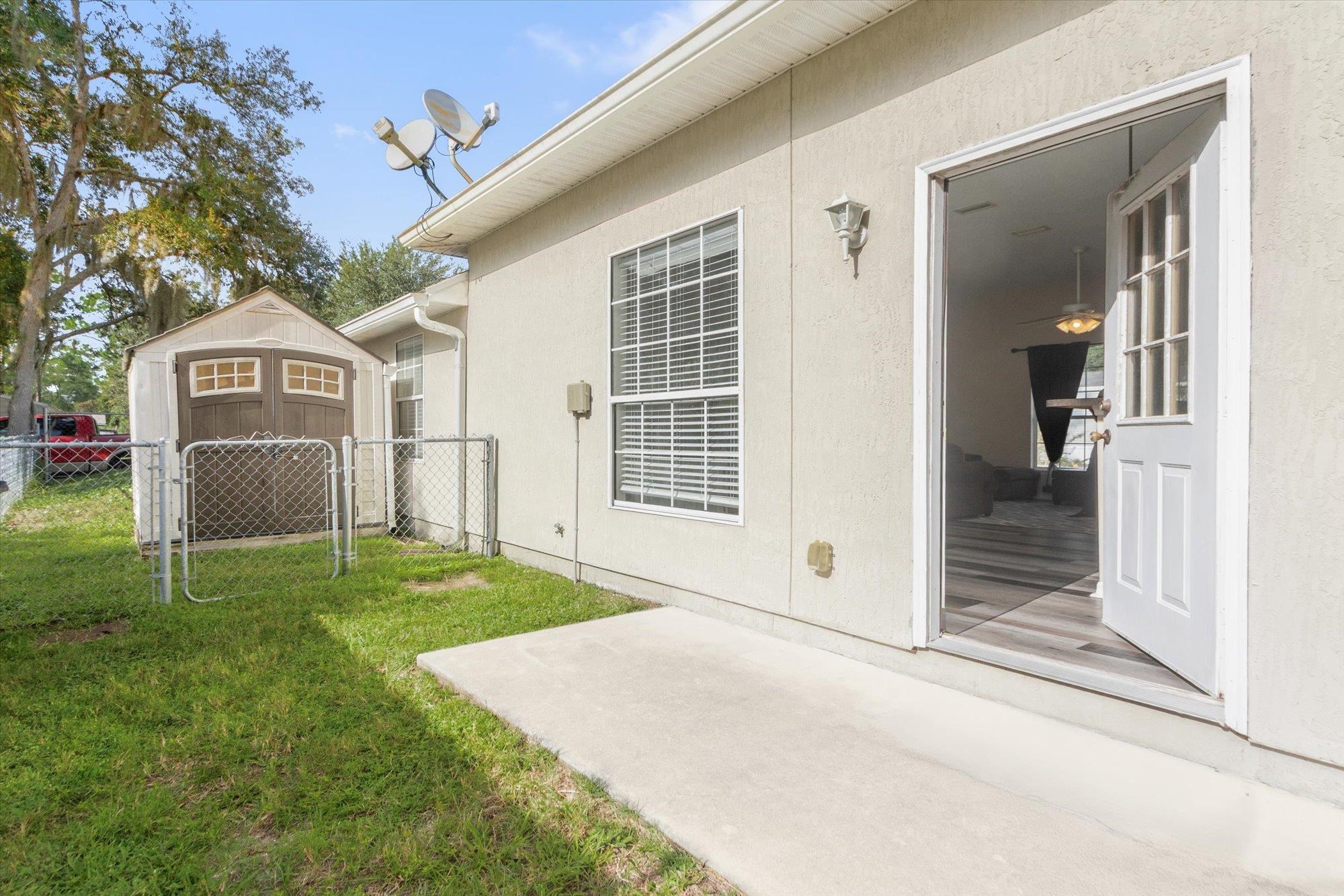 3372 4th Street Elkton, FL 32033 - Photo 26 of 36 a front view of a house with a yard