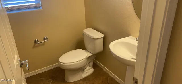 a bathroom with a toilet and a sink