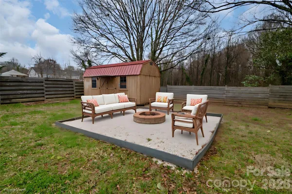 a view of a chairs and table in the garden