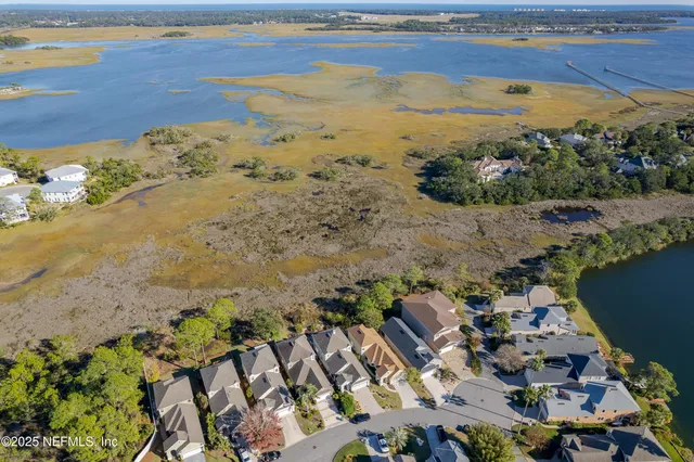 a kitchen with kitchen island granite countertop a sink cabinets and stainless steel appliances
