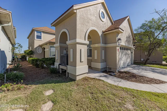 a aerial view of a house with a lake view