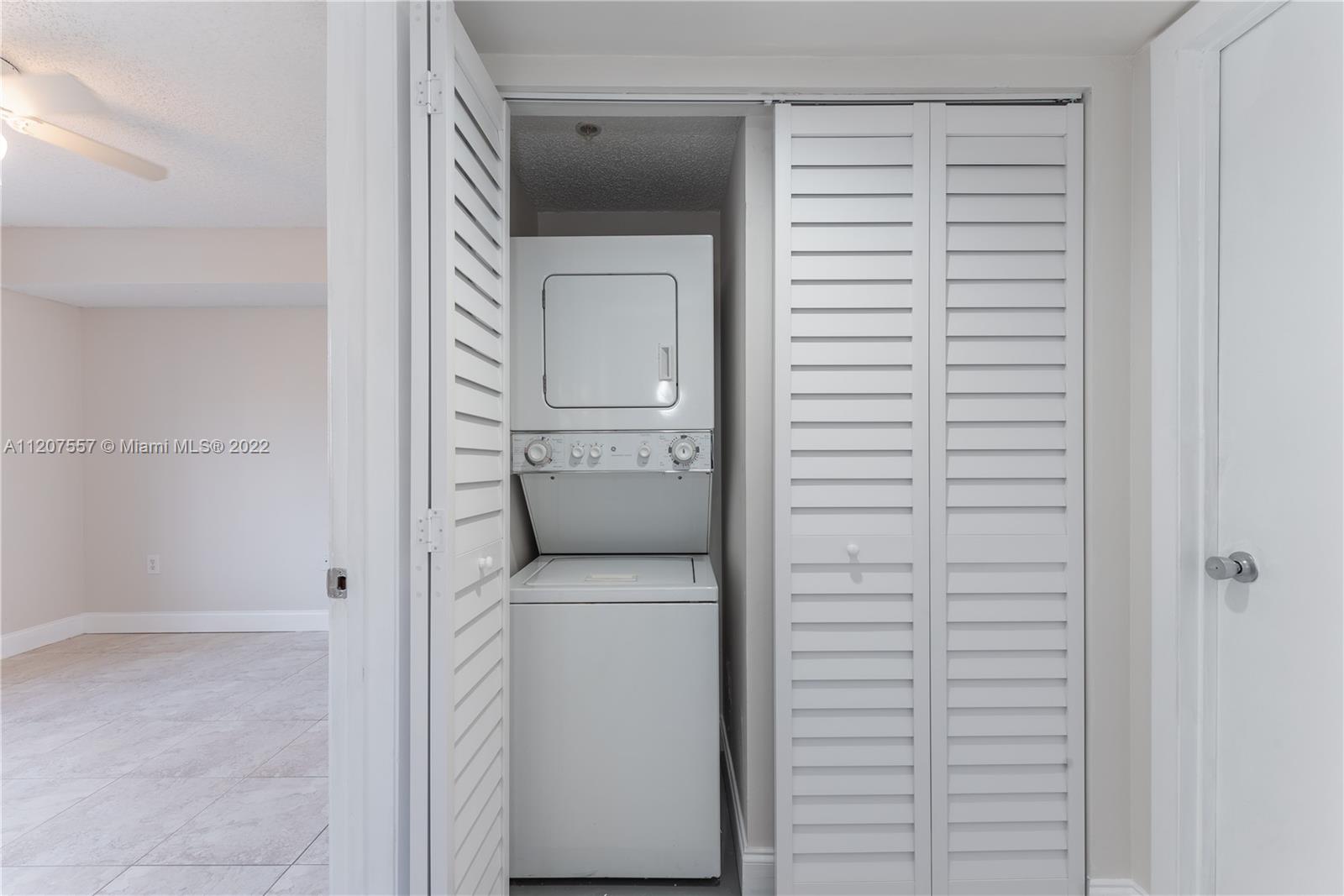 771 North Pine Island Road, Unit 203 Plantation, FL 33324 - Photo 8 of 20 a utility room with a washer and dryer