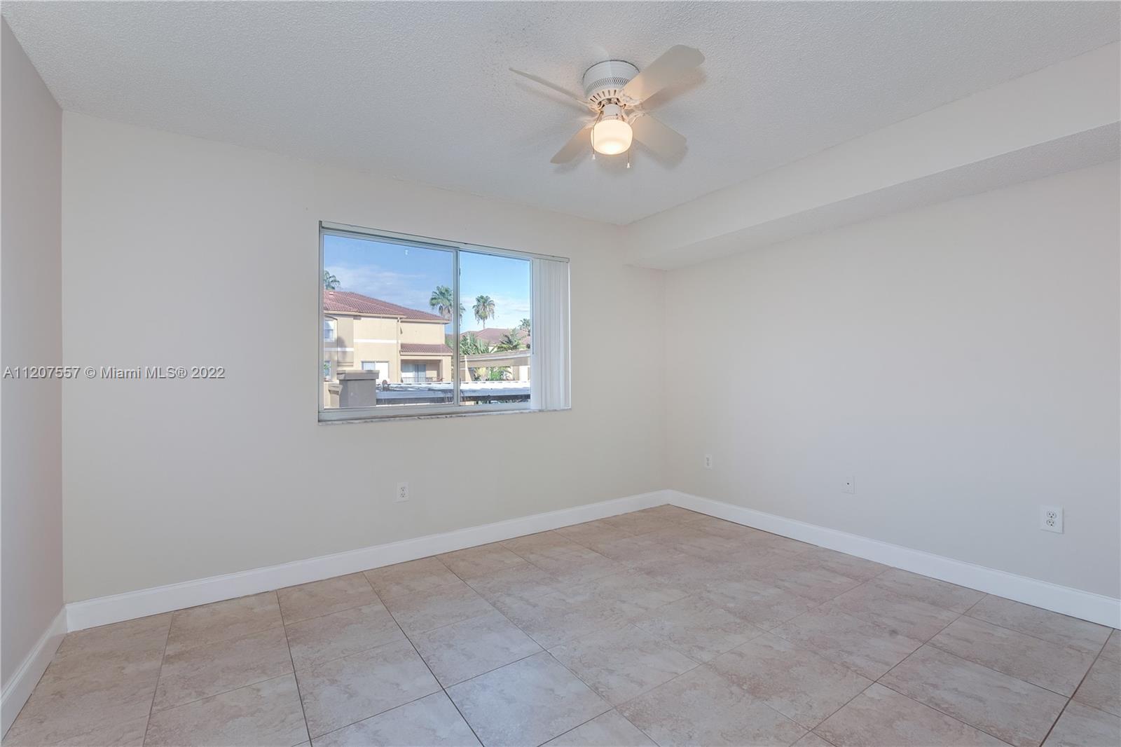 771 North Pine Island Road, Unit 203 Plantation, FL 33324 - Photo 9 of 20 an empty room with a window