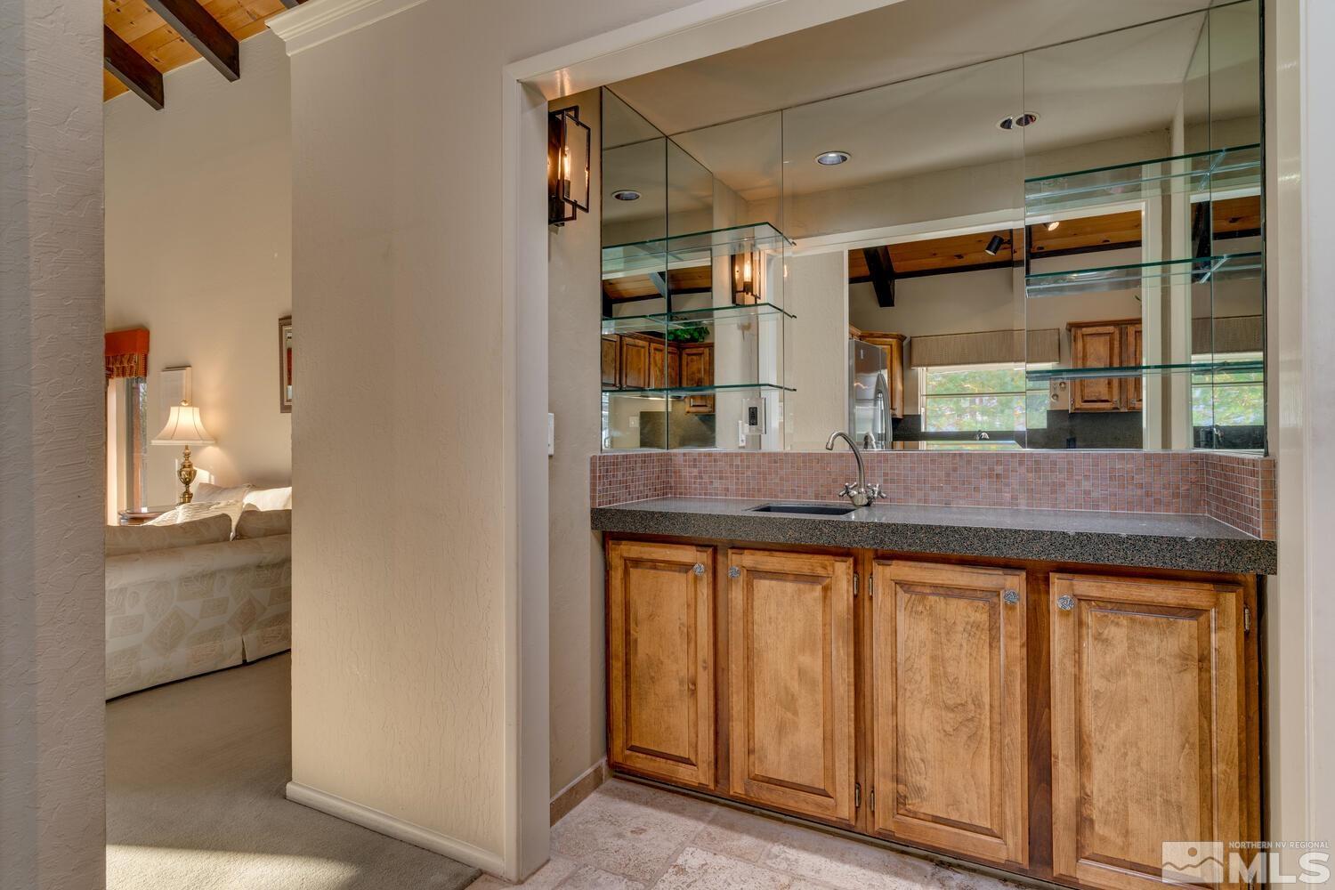 308 Elks Point Road Zephyr Cove, NV 89448 - Photo 13 of 29 a kitchen with granite countertop a sink and cabinets