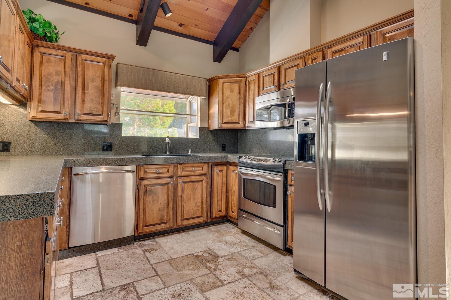 308 Elks Point Road Zephyr Cove, NV 89448 - Photo 14 of 29 a kitchen with a refrigerator sink and cabinets