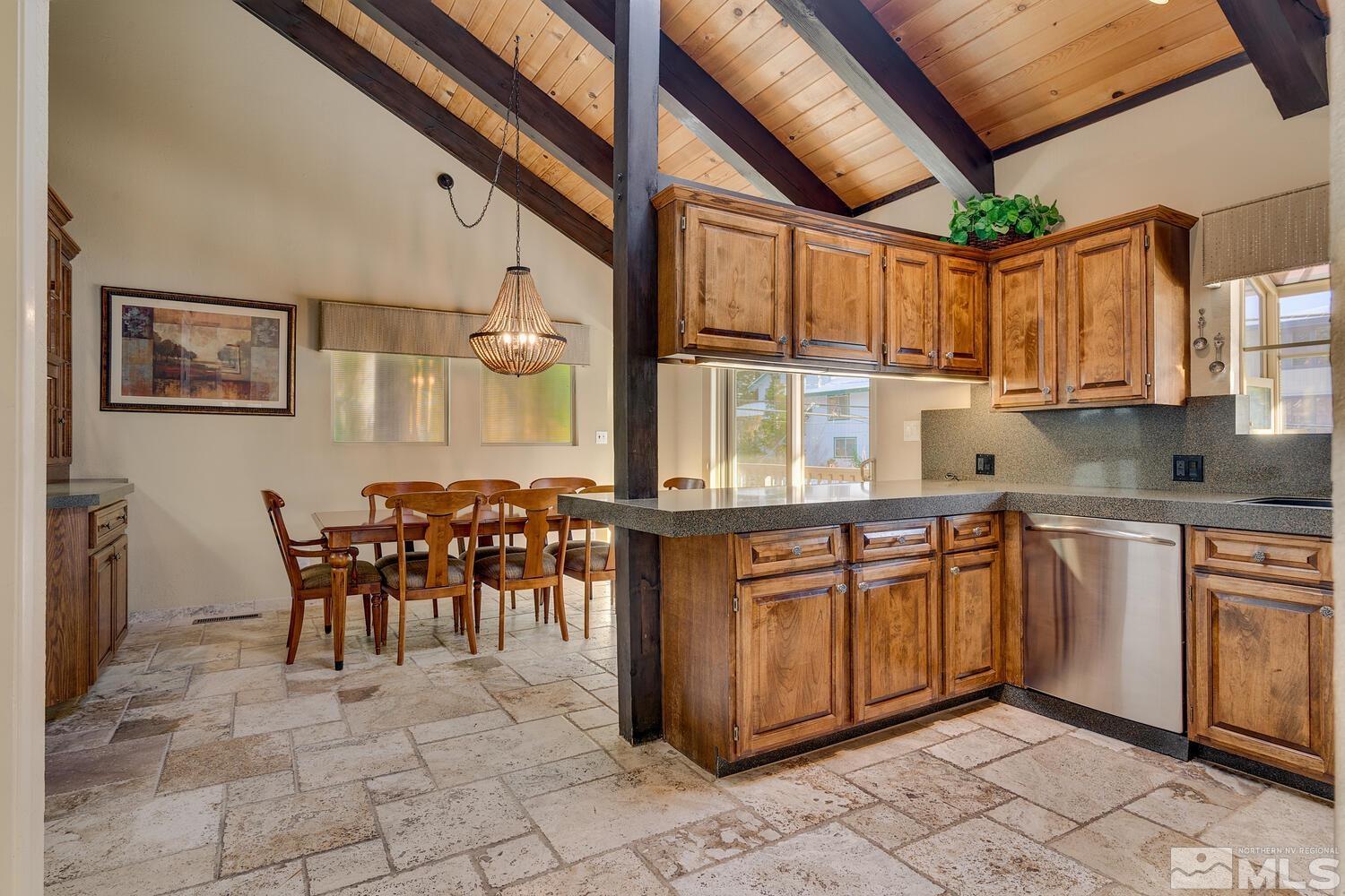 308 Elks Point Road Zephyr Cove, NV 89448 - Photo 15 of 29 a kitchen with stainless steel appliances granite countertop a stove a sink and a microwave