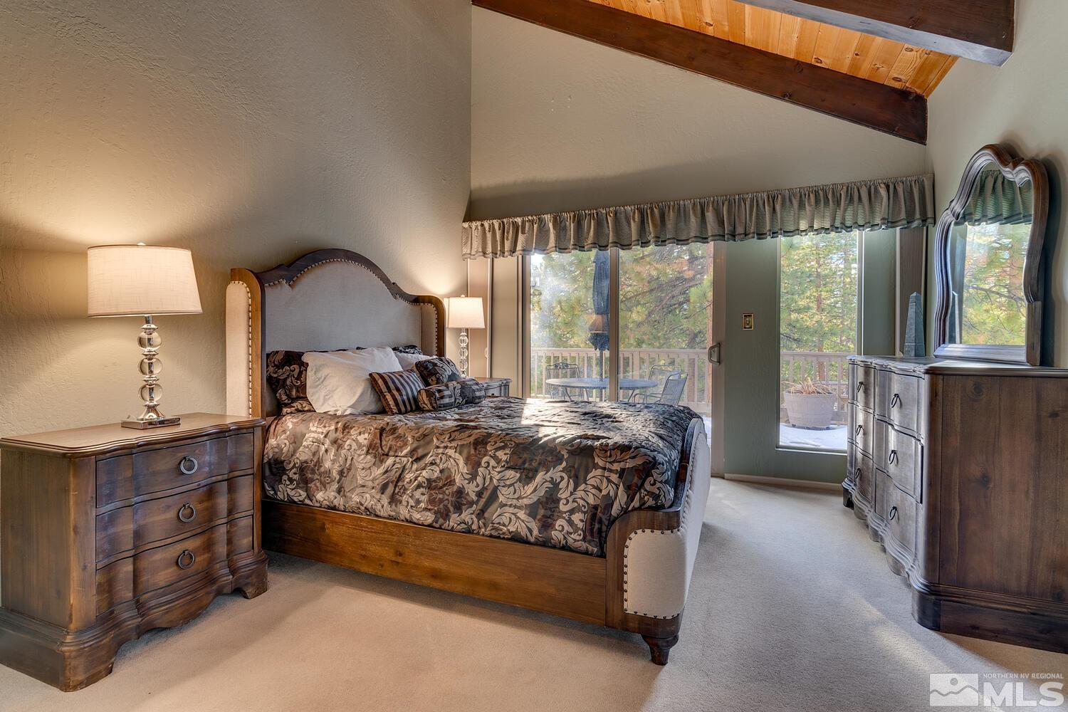 308 Elks Point Road Zephyr Cove, NV 89448 - Photo 18 of 29 a bedroom with a bed and a large window