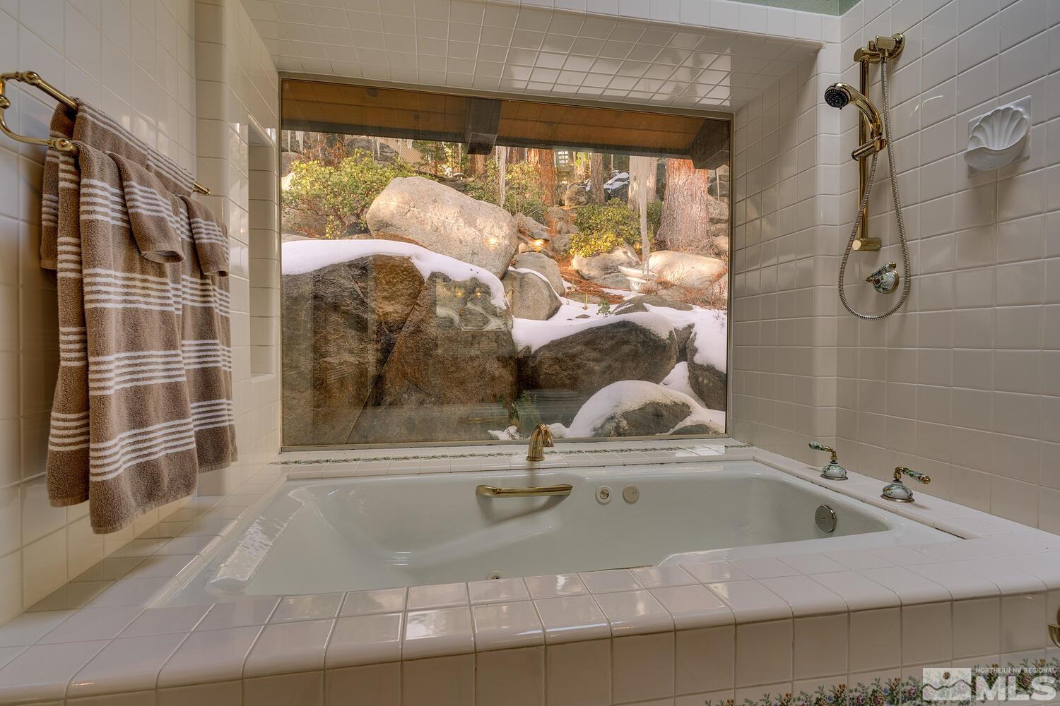 308 Elks Point Road Zephyr Cove, NV 89448 - Photo 20 of 29 a bathroom with a sink and a shower
