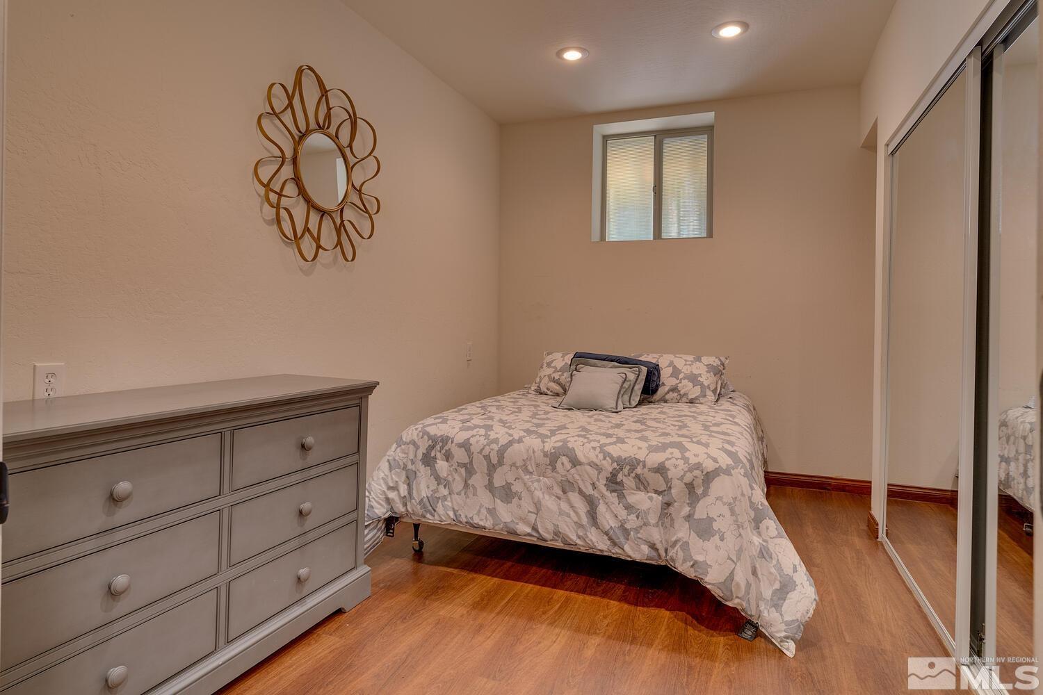 308 Elks Point Road Zephyr Cove, NV 89448 - Photo 21 of 29 a bedroom with a bed and painting on the wall