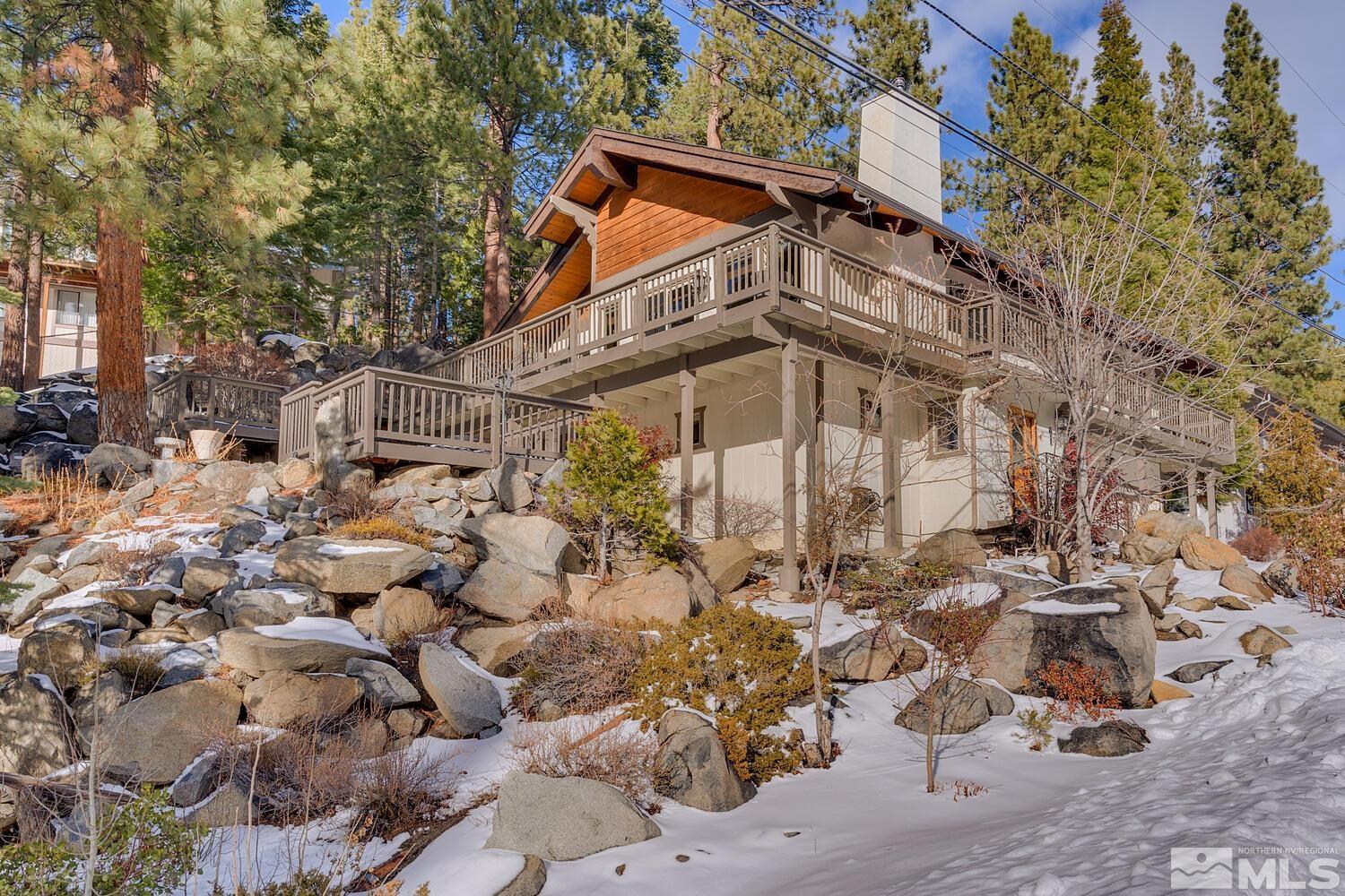 308 Elks Point Road Zephyr Cove, NV 89448 - Photo 3 of 29 a tall building with trees in front of it
