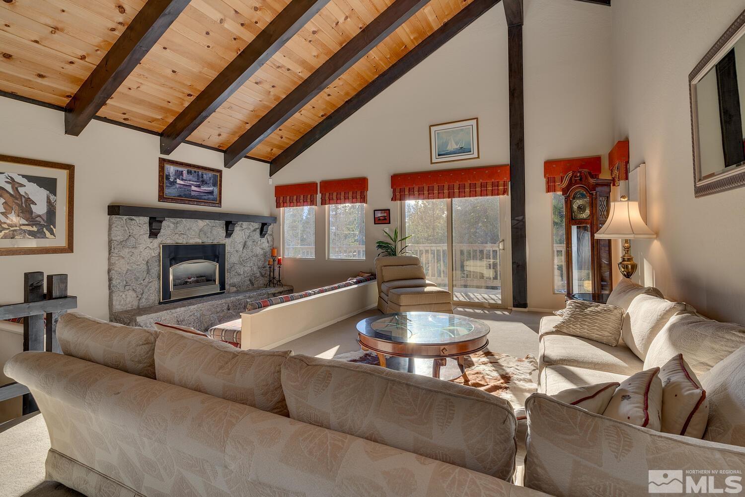 308 Elks Point Road Zephyr Cove, NV 89448 - Photo 9 of 29 a living room with furniture and a fireplace