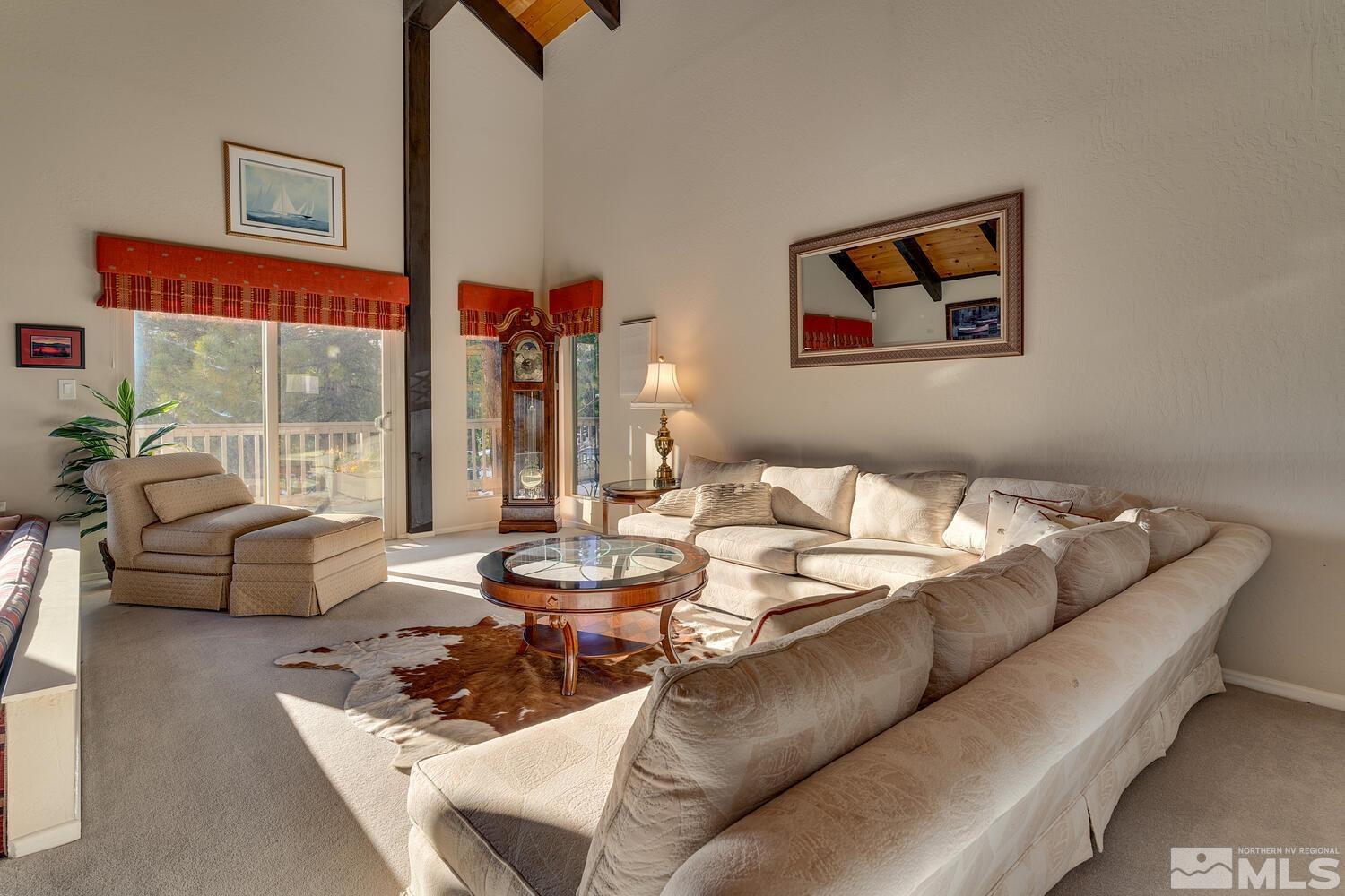 308 Elks Point Road Zephyr Cove, NV 89448 - Photo 10 of 29 a living room with furniture and a floor to ceiling window