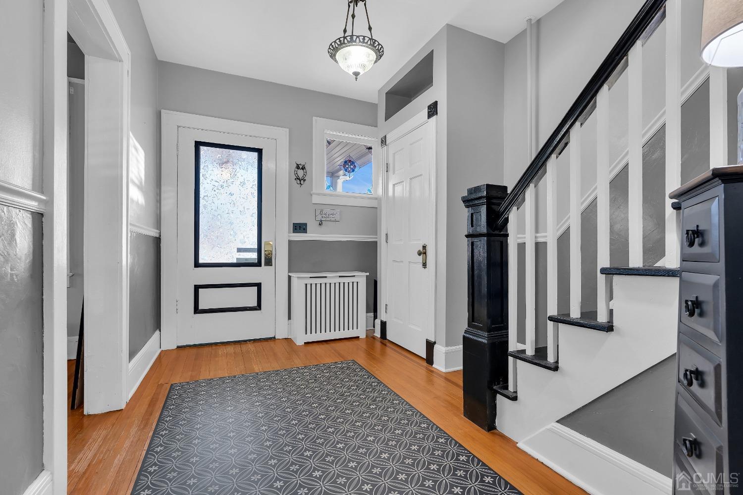 99 Thompson Street Raritan, NJ 08869 - Photo 8 of 38 a very nice looking room with wooden floor and furniture