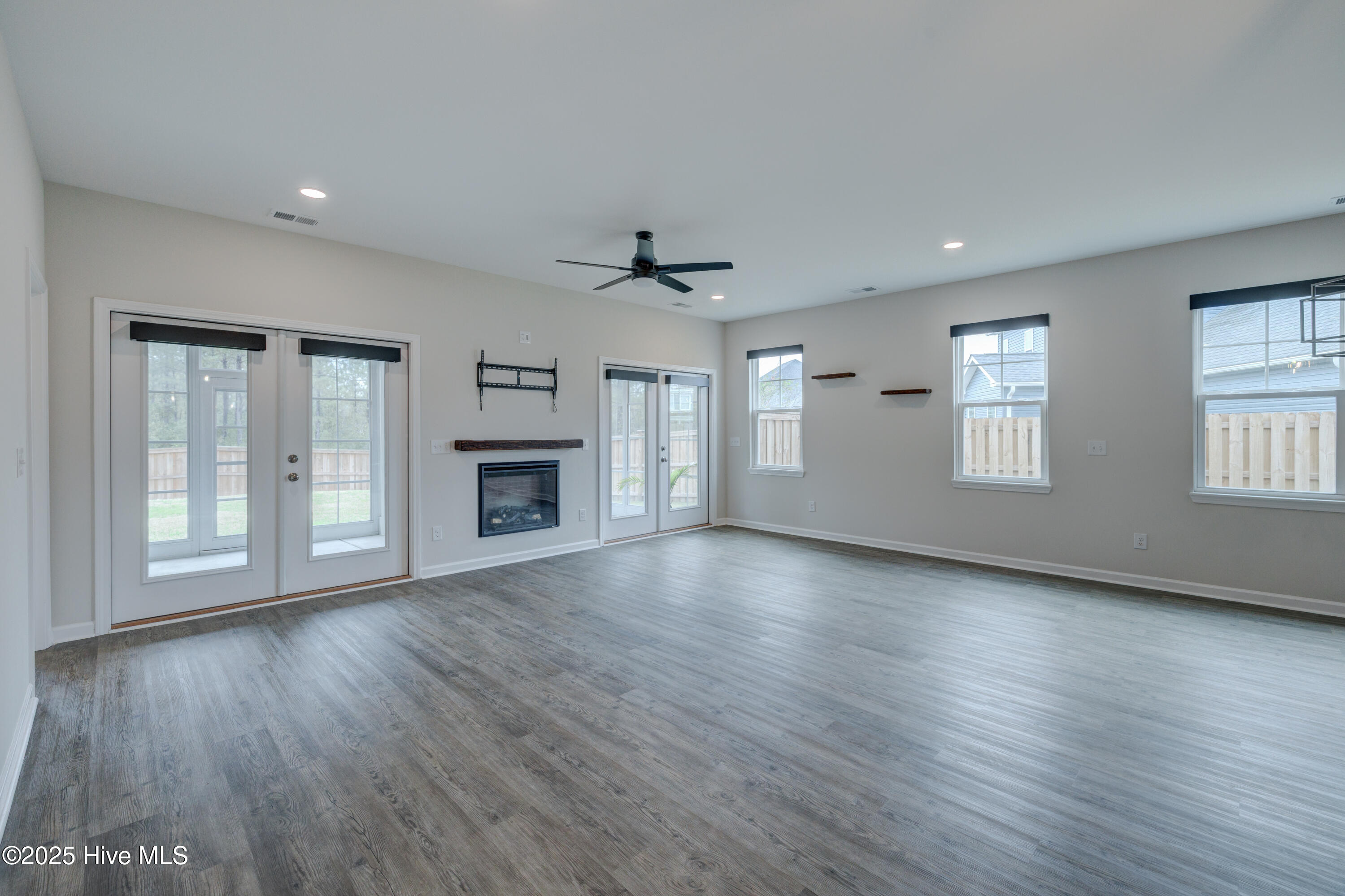 7053 Trailhead Road Leland, NC 28451 - Photo 6 of 67 Living Room with Electric Fireplace