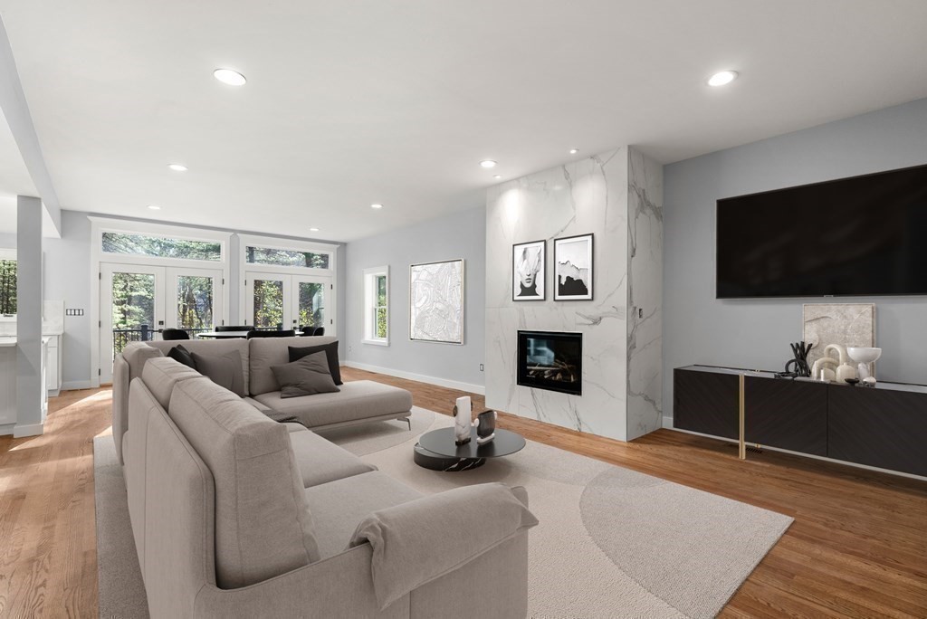 162 Winter Street Weston, MA 02493 - Photo 11 of 36 a living room with fireplace furniture and a flat screen tv