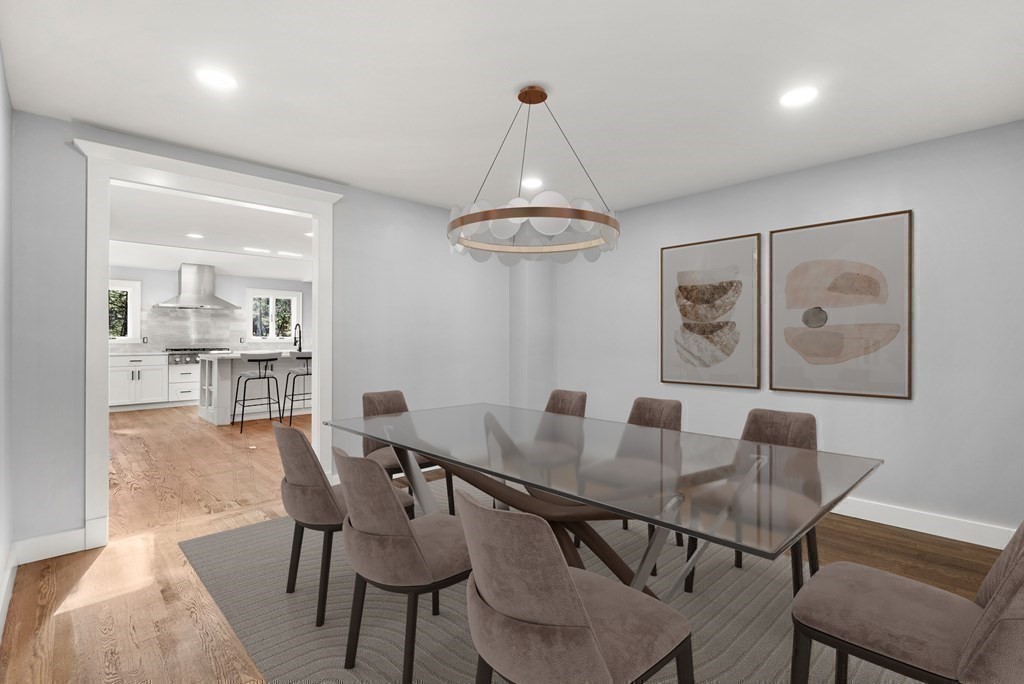 162 Winter Street Weston, MA 02493 - Photo 15 of 36 a view of a dining room with furniture wooden floor and chandelier