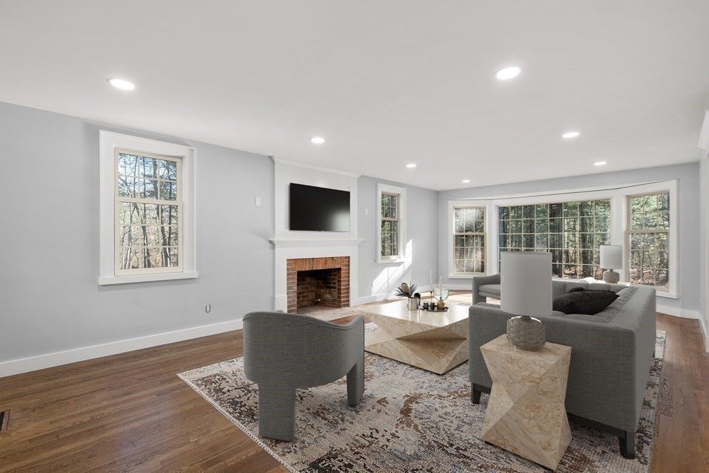 162 Winter Street Weston, MA 02493 - Photo 17 of 36 a living room with furniture fireplace and window