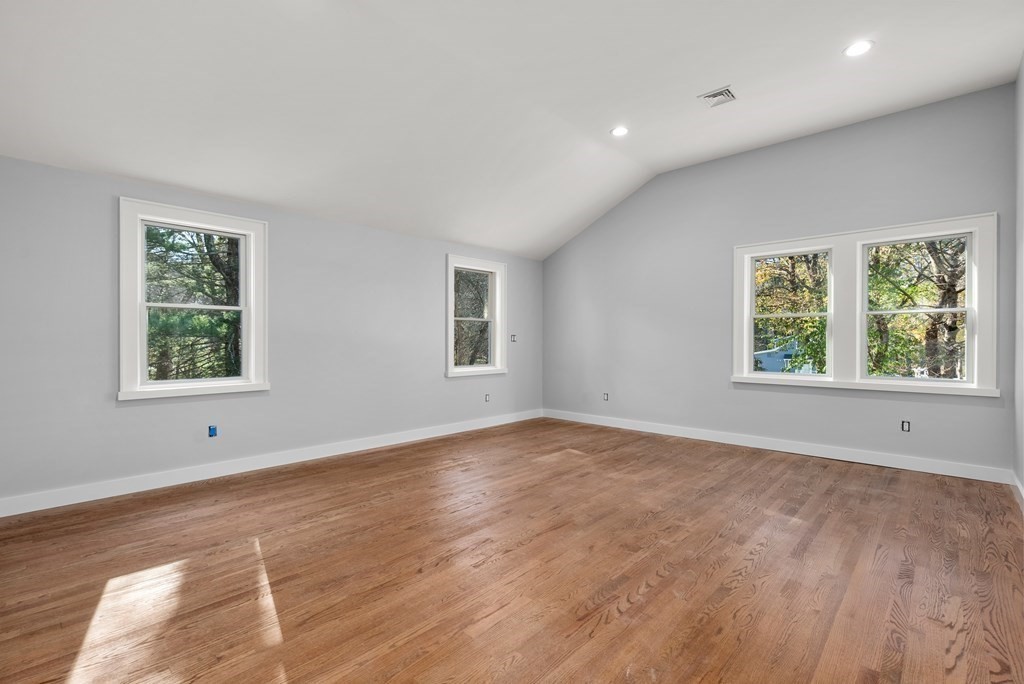 162 Winter Street Weston, MA 02493 - Photo 27 of 36 an empty room with wooden floor and windows