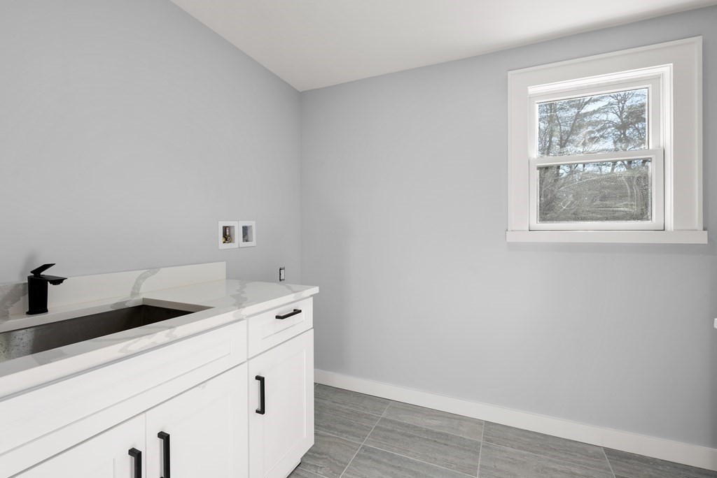 162 Winter Street Weston, MA 02493 - Photo 30 of 36 a utility room with dryer and washer