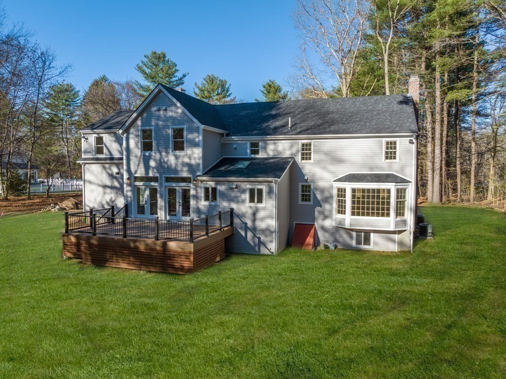 162 Winter Street Weston, MA 02493 - Photo 34 of 36 a front view of a house with a garden