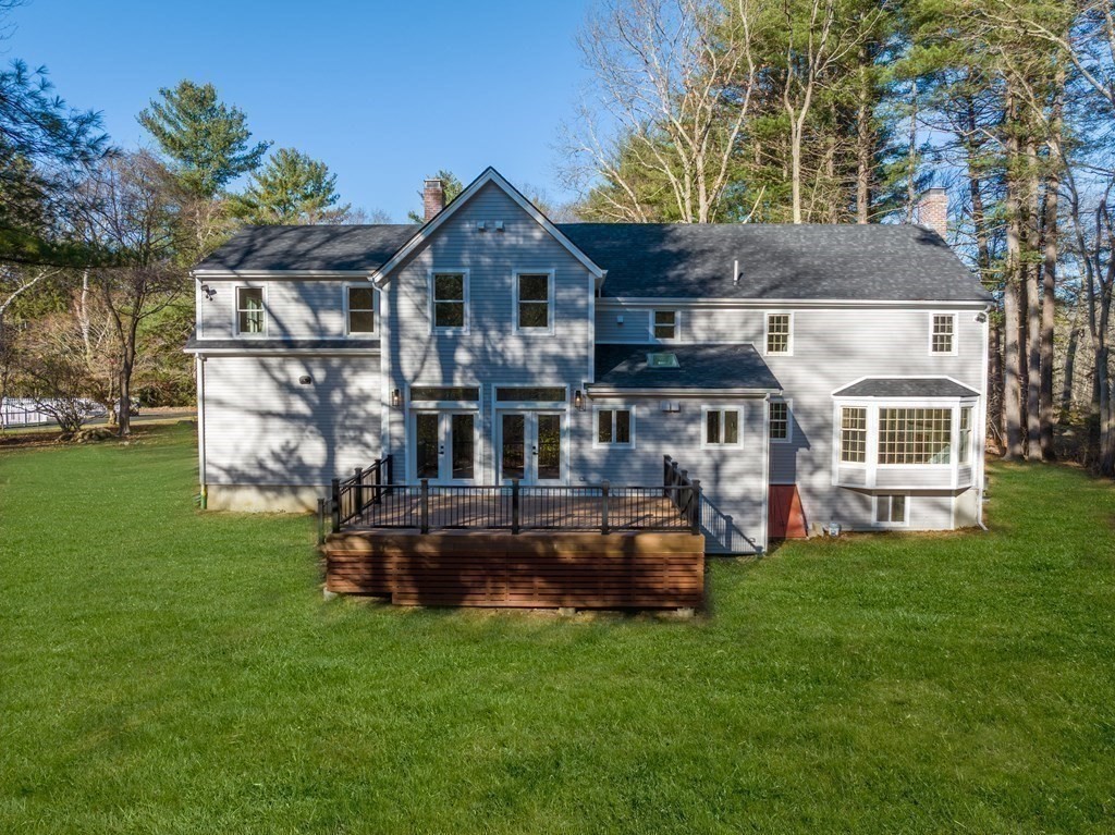 162 Winter Street Weston, MA 02493 - Photo 35 of 36 a front view of a house with a garden