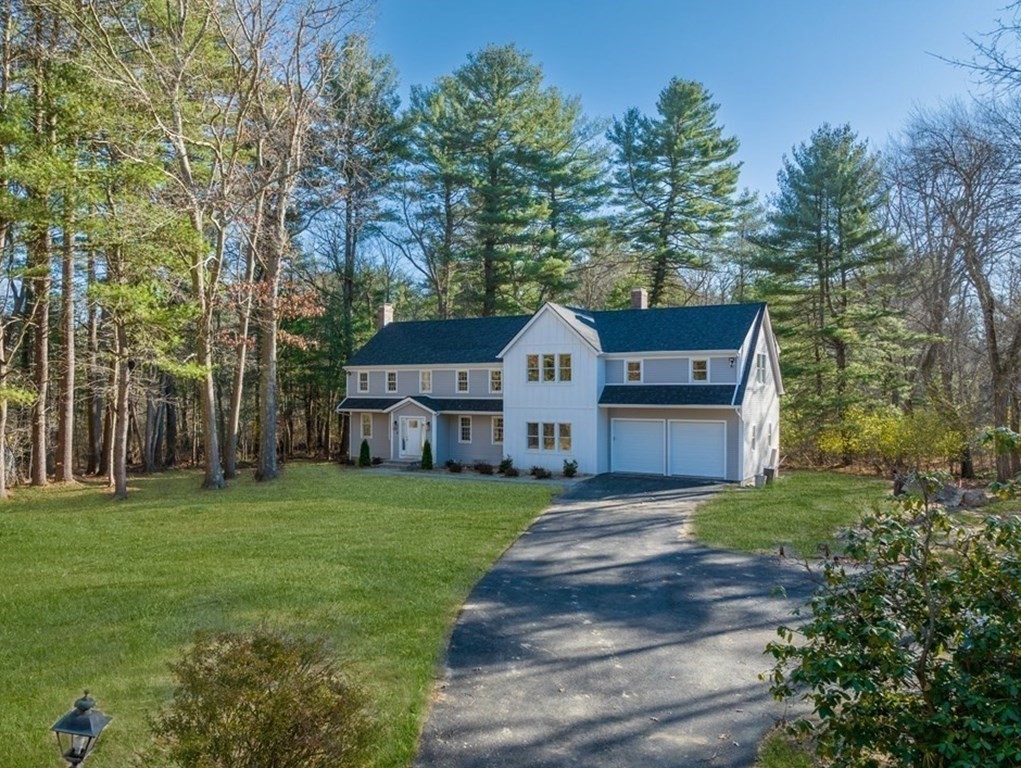 162 Winter Street Weston, MA 02493 - Photo 36 of 36 a front view of a house with garden
