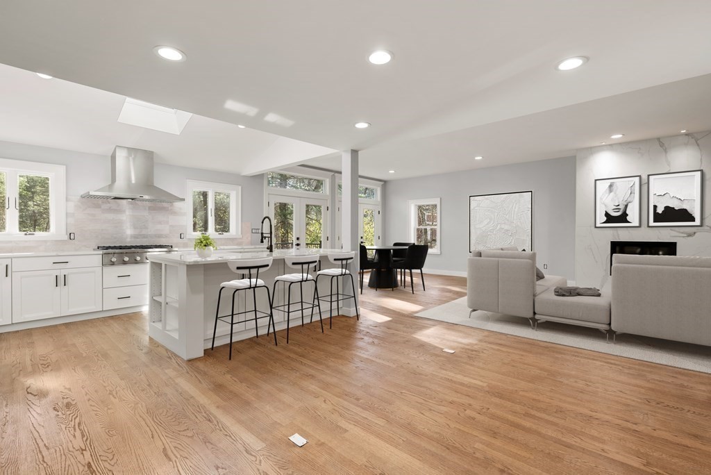 162 Winter Street Weston, MA 02493 - Photo 4 of 36 a kitchen with white cabinets and stainless steel appliances