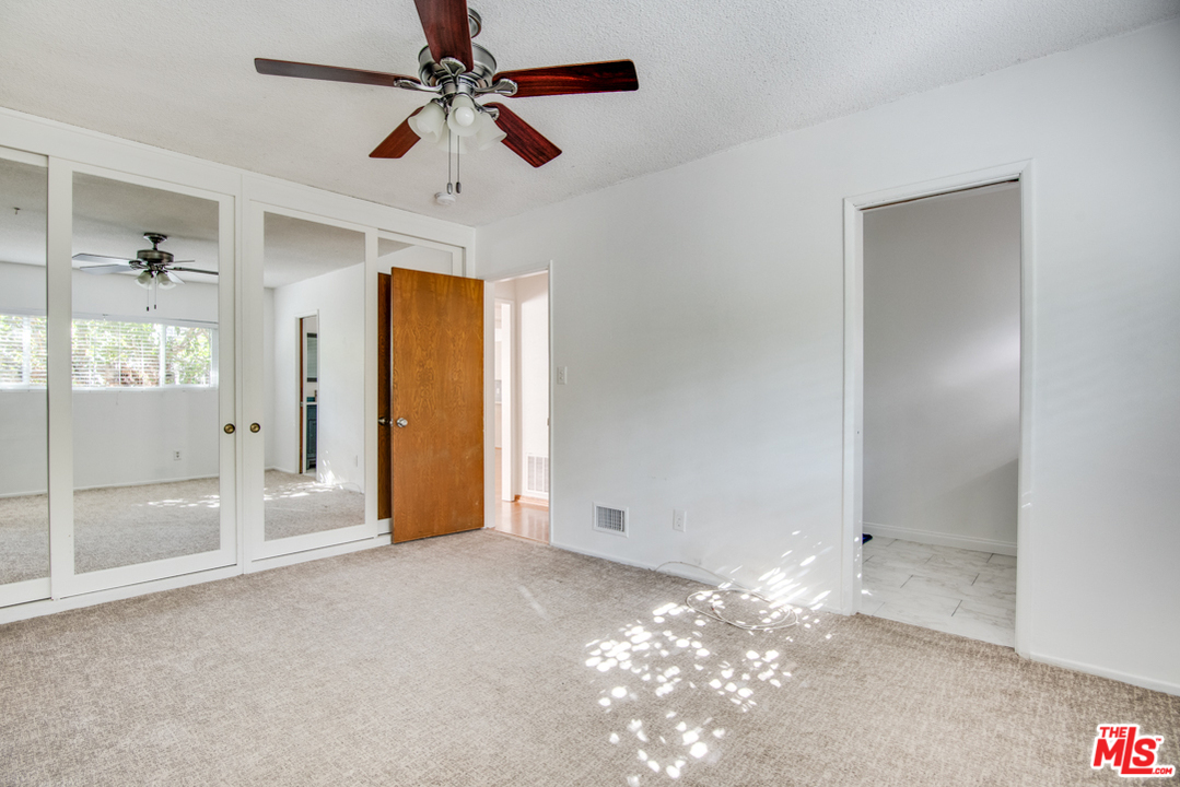 8204 Pershing Drive Playa del Rey, CA 90293 - Photo 17 of 27 a view of a livingroom with a chandelier fan and windows