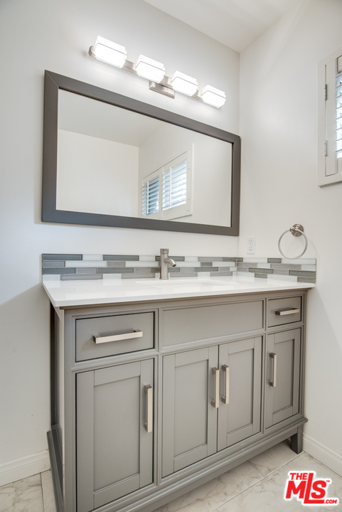 8204 Pershing Drive Playa del Rey, CA 90293 - Photo 22 of 27 a bathroom with a sink and a mirror