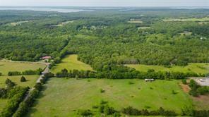 Tbd1 Flowing Wells Road Pottsboro, TX 75076 - Photo 15 of 19 a view of a lush green outdoor space with a lake view