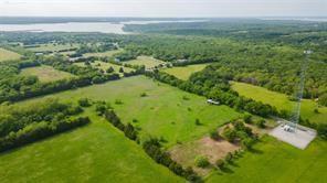 Tbd1 Flowing Wells Road Pottsboro, TX 75076 - Photo 17 of 19 a view of a green field with lots of buildings