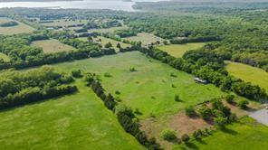 Tbd1 Flowing Wells Road Pottsboro, TX 75076 - Photo 3 of 19 an aerial view of residential houses with outdoor space and trees