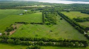 Tbd1 Flowing Wells Road Pottsboro, TX 75076 - Photo 9 of 19 a view of a green yard with large trees