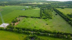 Tbd1 Flowing Wells Road Pottsboro, TX 75076 - Photo 10 of 19 a view of a green field with lots of trees