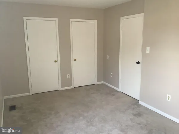 a view of a bathroom from a hallway
