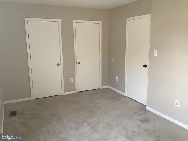 a view of a bathroom from a hallway