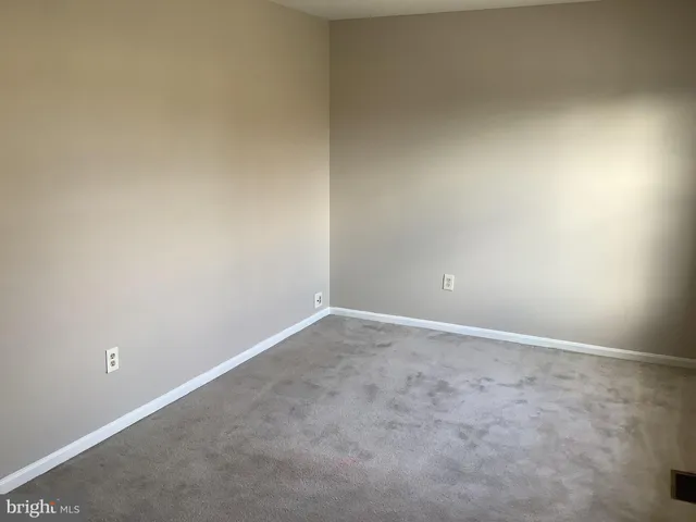 a bathroom with a granite countertop shower and a sink