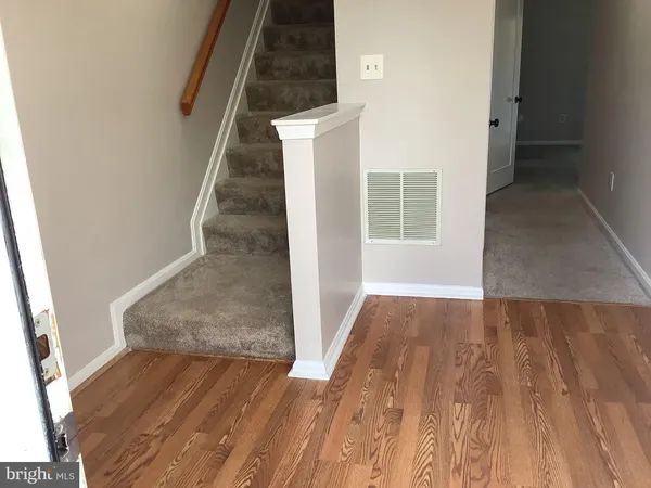 an entryway with a white walls