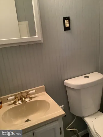 a view of a small yard with wooden fence