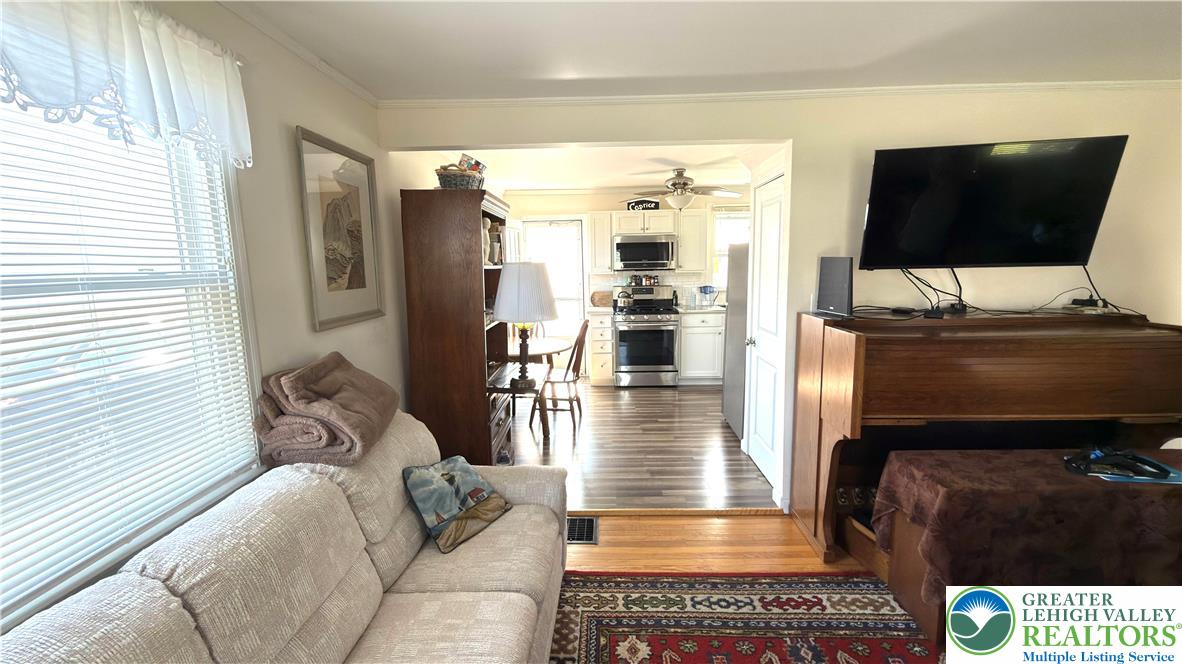462 Maple Road Hellertown, PA 18055 - Photo 8 of 25 a living room with furniture and a flat screen tv