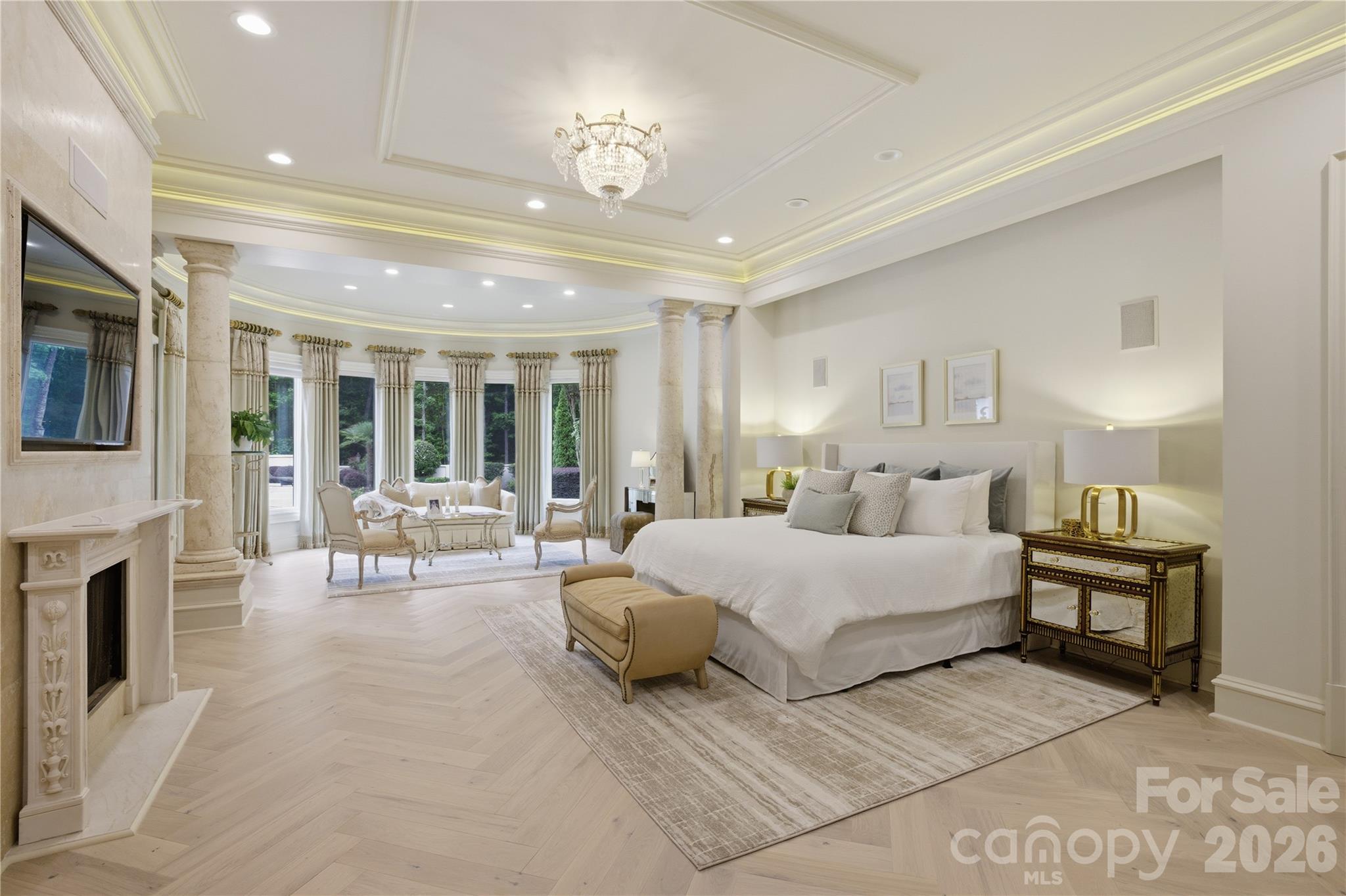 16460 Marvin Road Charlotte, NC 28277 - Photo 18 of 47 a spacious bedroom with a large bed a flat tv screen and a fireplace