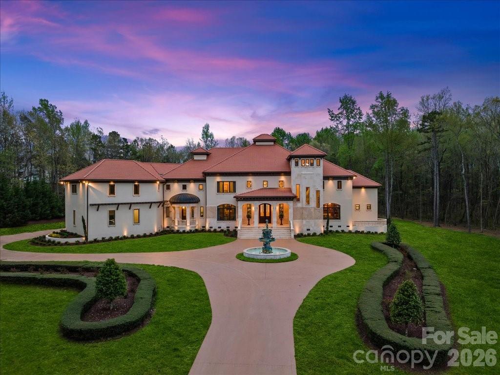 16460 Marvin Road Charlotte, NC 28277 - Photo 2 of 47 a view of a big house with a big yard and potted plants