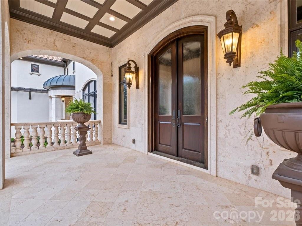 16460 Marvin Road Charlotte, NC 28277 - Photo 4 of 47 an entryway with a potted plant in front of it