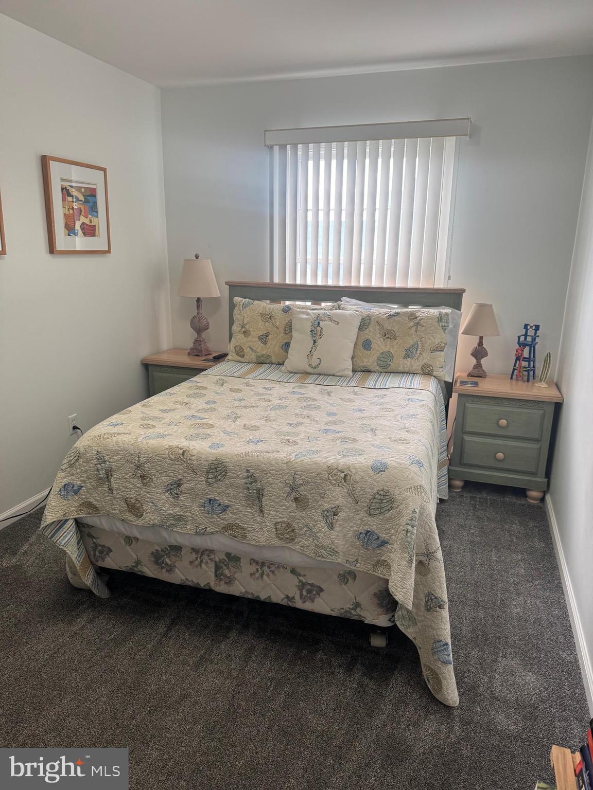 608 B Salt Spray Road, Unit B Ocean City, MD 21842 - Photo 30 of 50 a bedroom with a bed and window