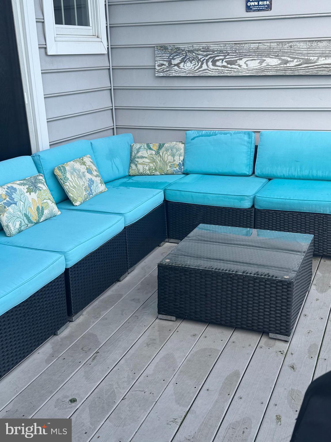 608 B Salt Spray Road, Unit B Ocean City, MD 21842 - Photo 41 of 50 a bedroom with a bed and a table