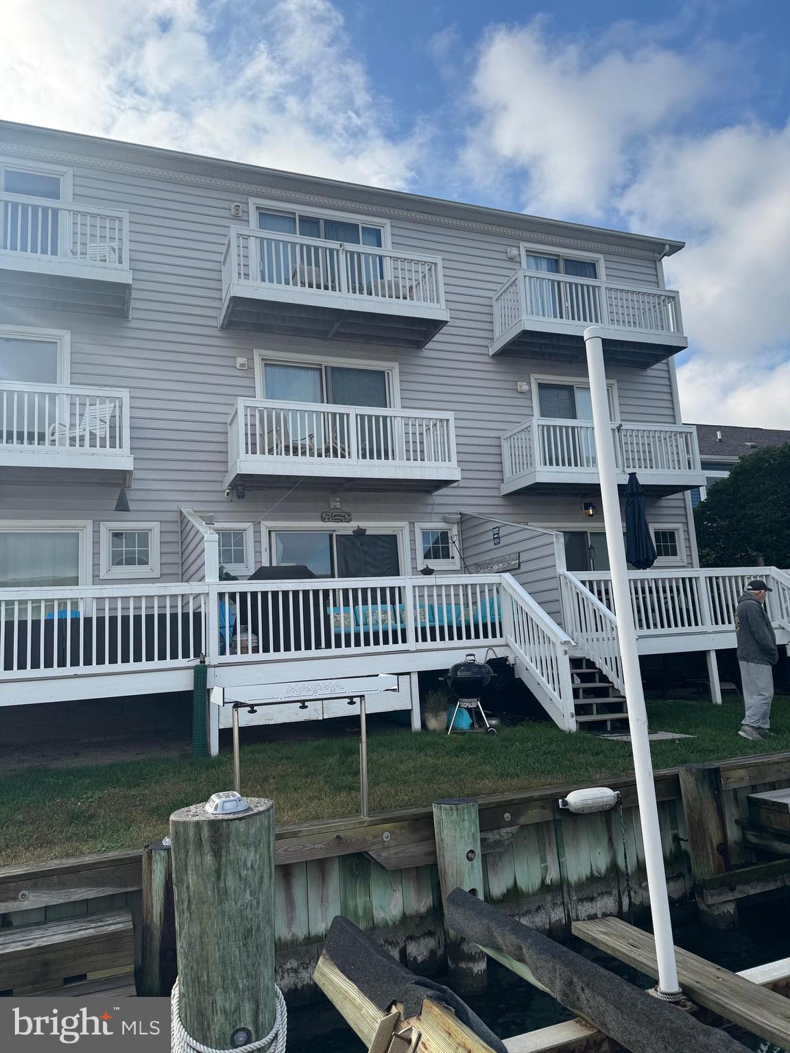608 B Salt Spray Road, Unit B Ocean City, MD 21842 - Photo 49 of 50 a view of a roof deck with couches and wooden floor