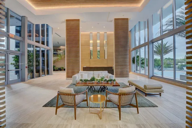 a building outdoor space with patio furniture and potted plants