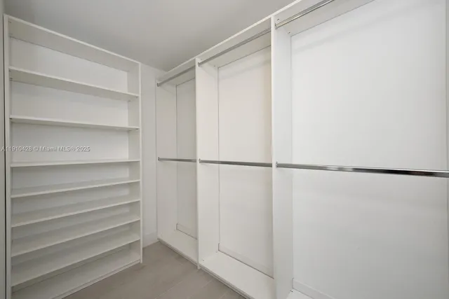 a view of an empty walk in closet