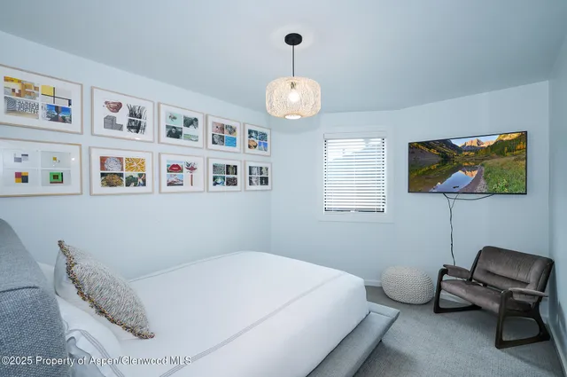 a bedroom with a bed and furniture