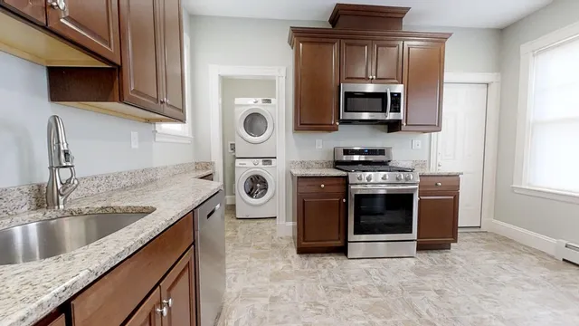 a kitchen with a stove and a microwave